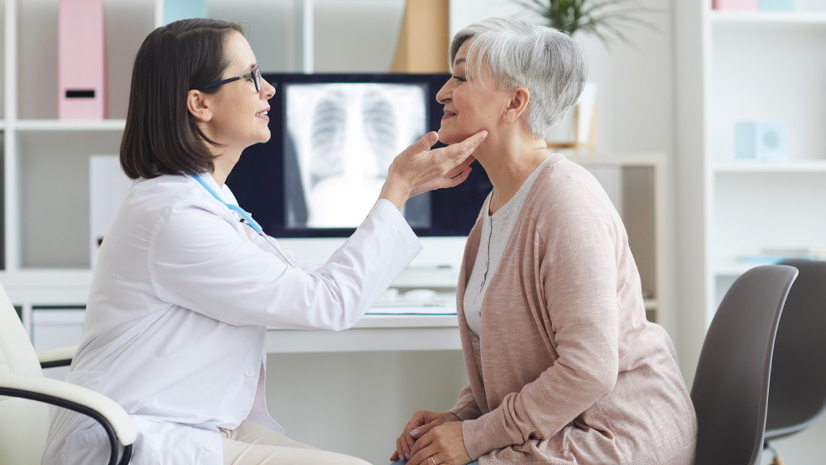 Female doctor palpating neck of senior woman 2021 09 24 04 08 53 utc